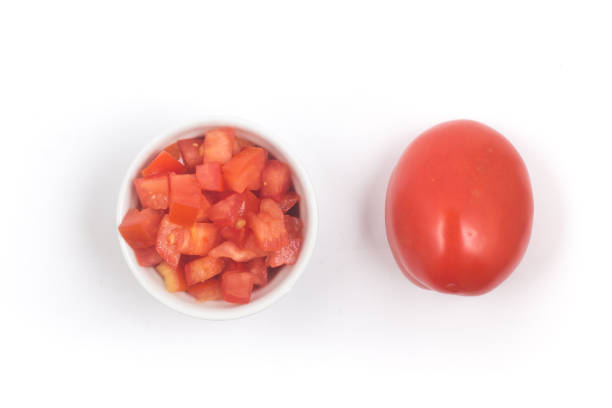 istock Chopped Tomatoes in a white bowl Top view 1081086324