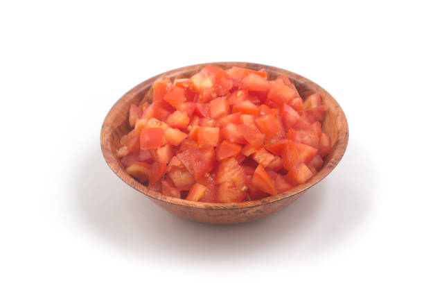 istock Chopped Tomatoes in a wooden  bowl 1081086396