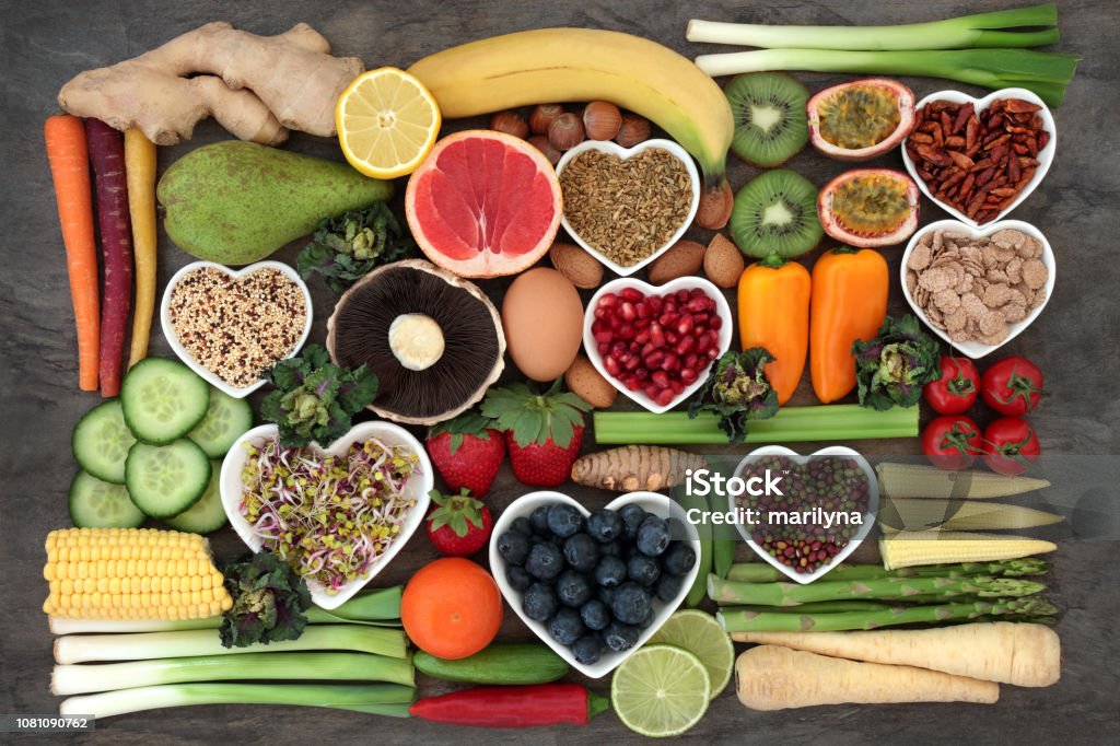 Super Food for a Healthy Diet Super food concept for a healthy diet with fruit and vegetables, dairy, spices, nuts, legumes, cereals and grains, high in antioxidants, anthocyanins, dietary fibre and vitamins. Healthy Eating Stock Photo