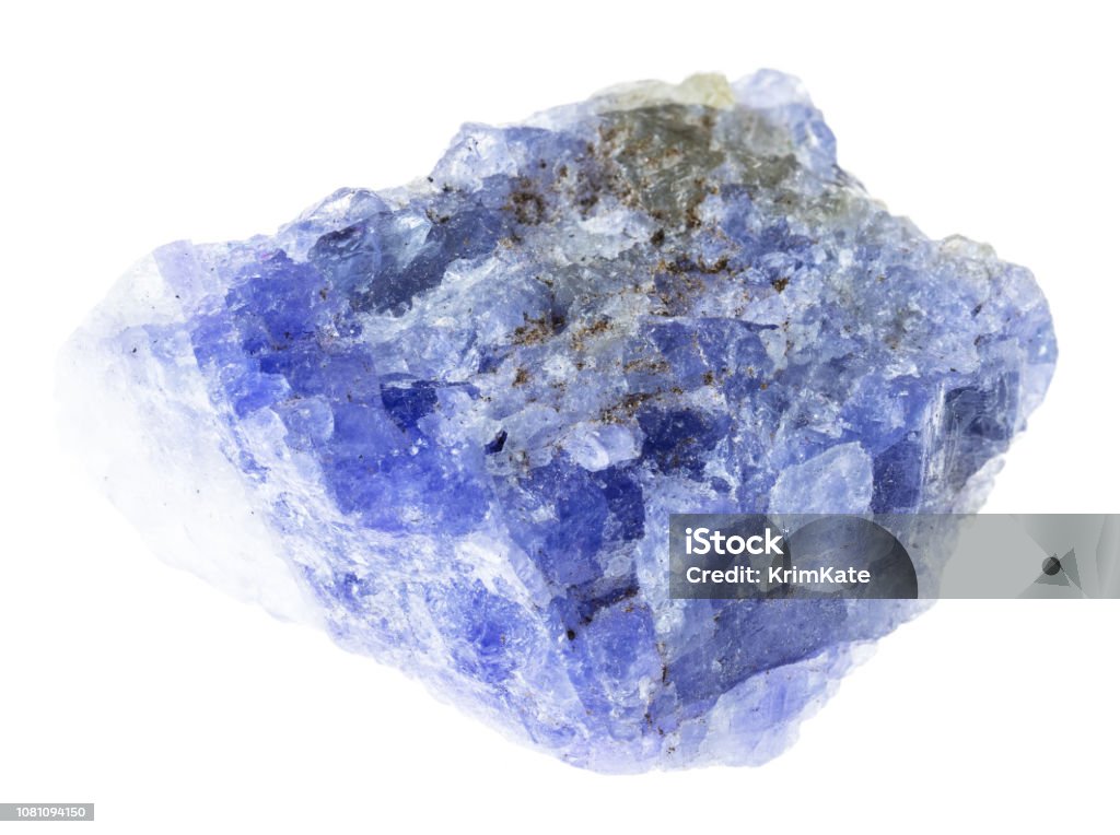 raw tanzanite stone on white macro photography of natural mineral from geological collection - raw tanzanite (blue and violet zoisite) stone on white background Tanzanite Stock Photo