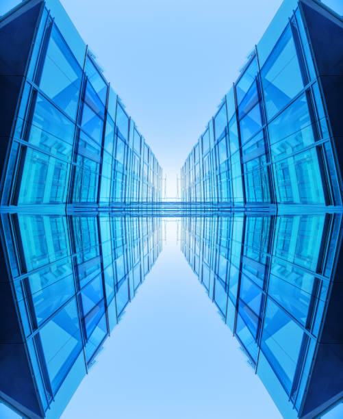 A wall made of square mirrors reflects the sky and the clouds