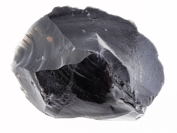 istock piece of rough obsidian stone on white 1081099040