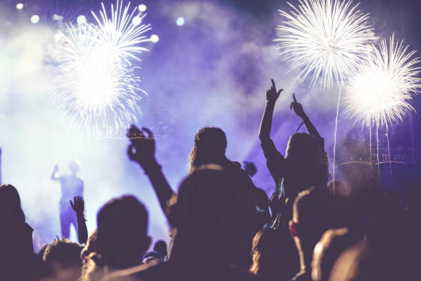 istock crowd watching fireworks - New Year celebrations- abstract holiday background 1081099222