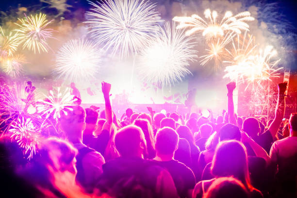 istock crowd watching fireworks - New Year celebrations- abstract holiday background 1081099238