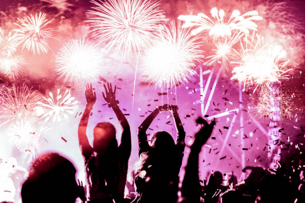istock crowd watching fireworks - New Year celebrations- abstract holiday background 1081099250