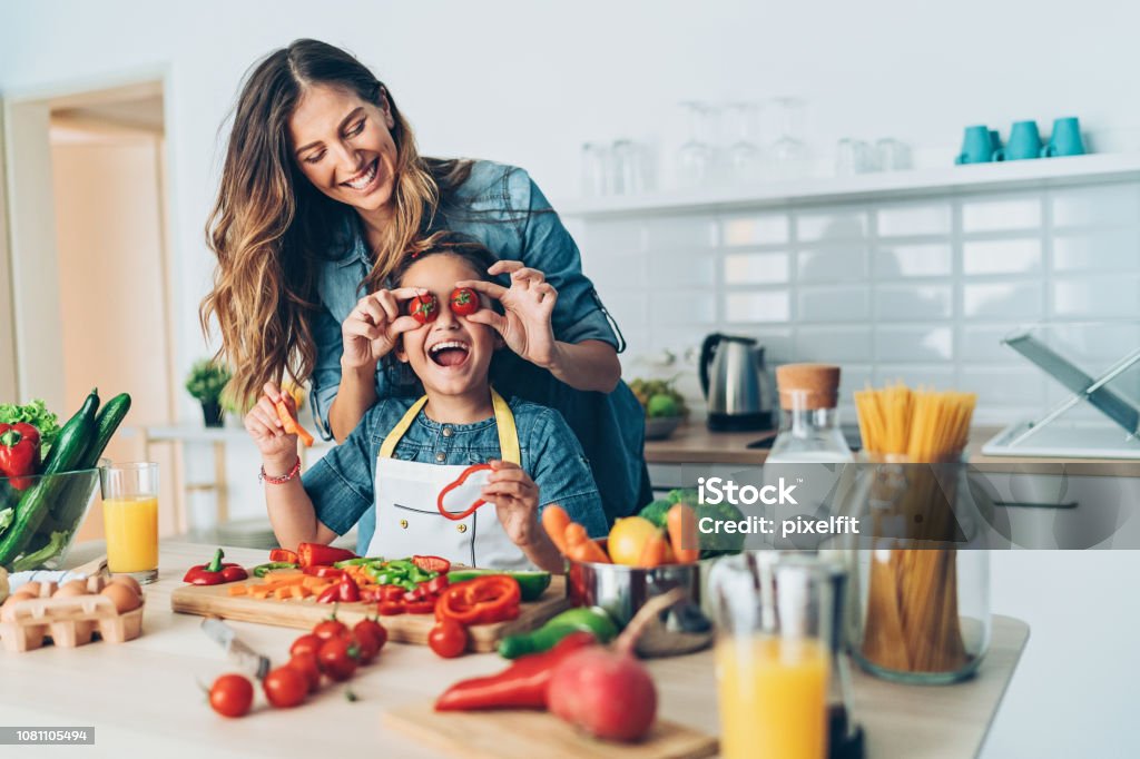 Happy time in the kitchen Playful mother and daughter in the kitchen Kitchen Stock Photo