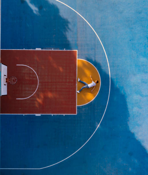istock Shooting basketball field with drone from above 1081105888