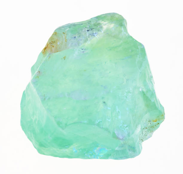 istock raw green Calcite stone on white 1081107806
