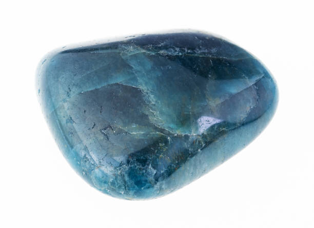 istock tumbled blue green apatite gem stone on white 1081109962