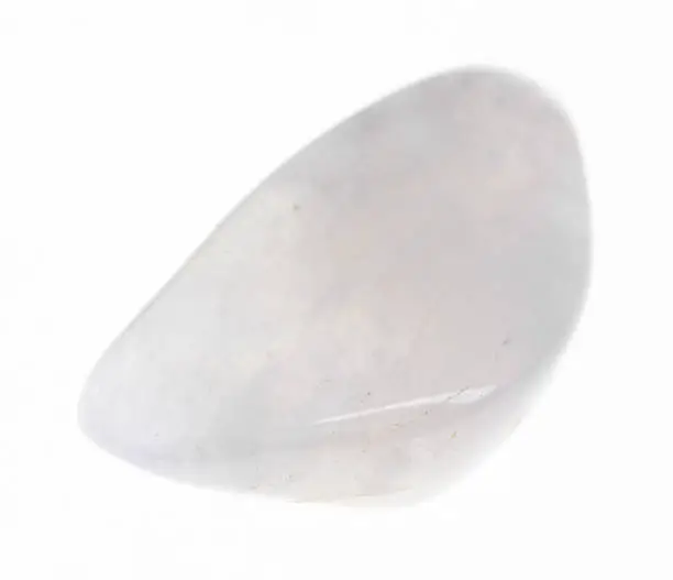 macro photography of natural mineral from geological collection - polished moonstone (adularia) gem stone on white background