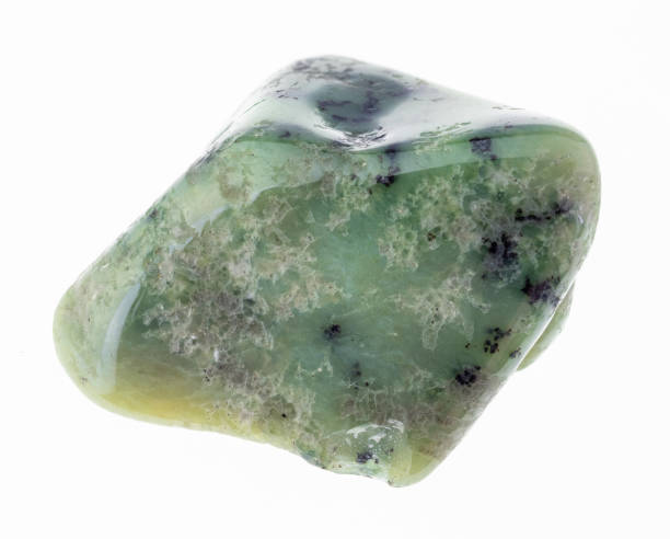 istock polished green garnet Grossular gem stone on white 1081110142