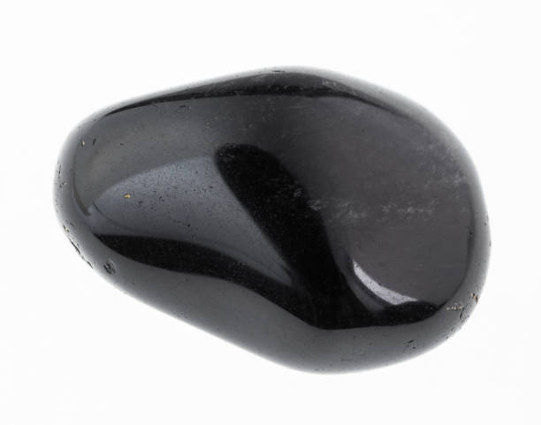 tumbled obsidian) gemstone on white stock photo