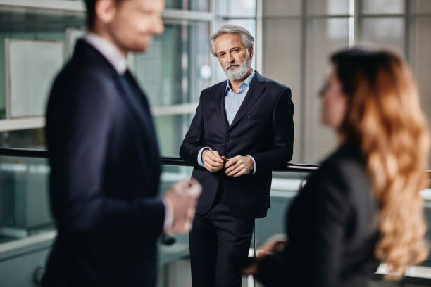 istock handsome senior business man  in a corporate setting 1081111050