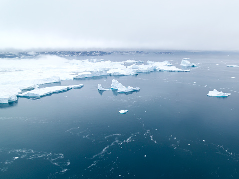 Arctic Pole in Greenland. Icebergs on arctic ocean in Ilulissat disco bay.