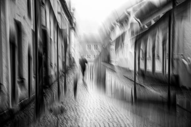 Textured motion blur street image with one person walking.