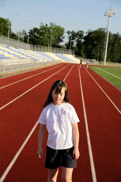 istock Little girl have fun on the stadium 1081124502