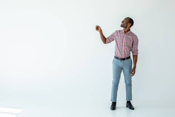 istock Joyful afro american man holding an umbrella 1081131480