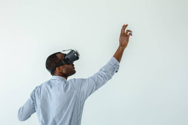 istock Pleasant afro american man testing VR glasses 1081131546