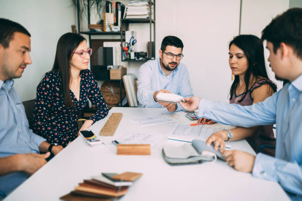 istock Group of young engineers brainstorming and working in the office 1081131690