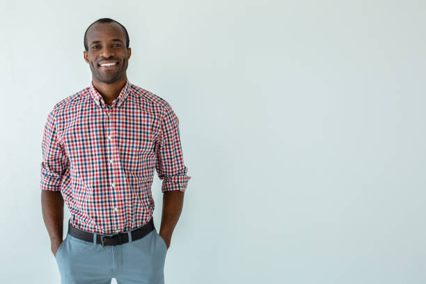 Cheerful afro american man smiling against white background