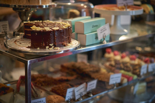 istock A chocolate and salted caramel cake on display in a bakery with other cakes on a blurred background. 1081136204