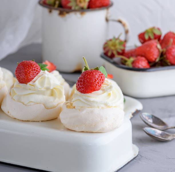 istock baked meringue with cream and fresh strawberries 1081139110