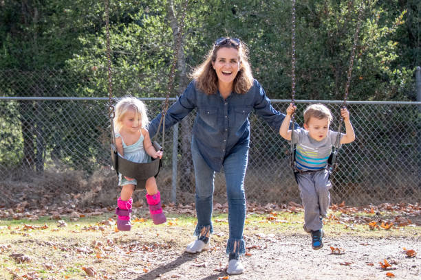 istock Mature woman playing with her children 1081139738