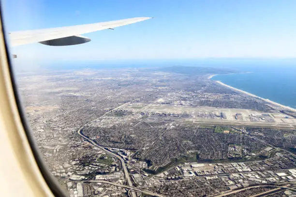 Aerial shot of pacific coastline and Los Angeles airport from a commercial airliner arriving at Los Angeles
