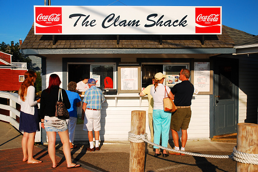 Kennebunkport, ME, USA August 12, 2013 Folks line up at a clam shack in Kennebunkport, Maine for a summer meal on a sunny day