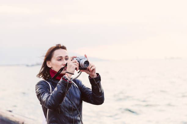 istock Young Woman Taking a Picture 1081146586