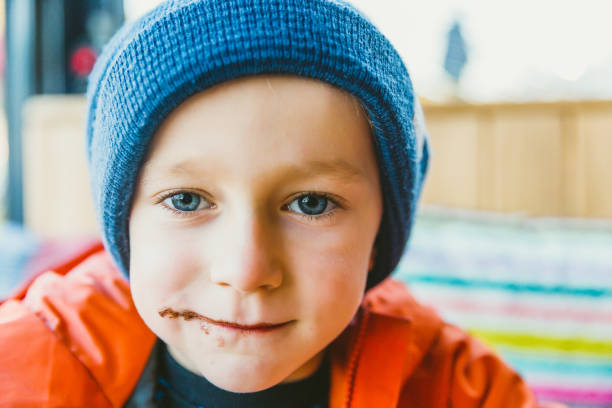 Little Boy Looking Out Through the Window
