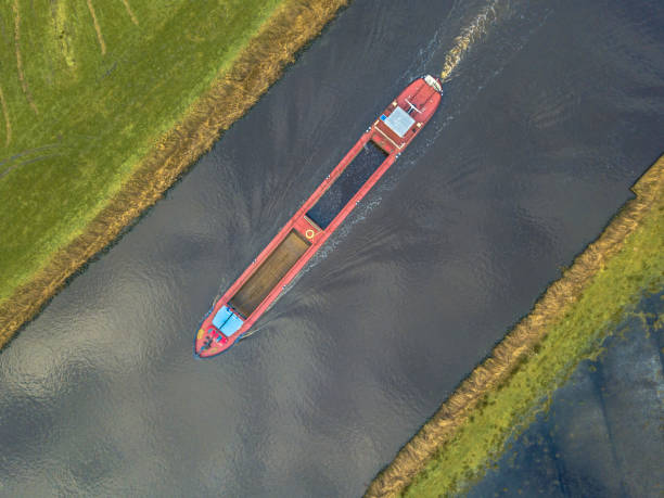 Top view of inland cargo ship Top down view on inland cargo ship in dutch canal canal stock pictures, royalty-free photos & images