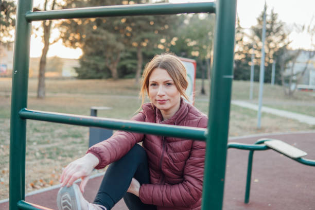istock Female athlete stretching outdoors 1081156316