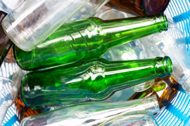 istock Glass bottles in waste basket. 1081157578