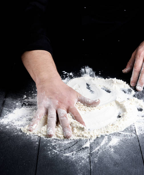 istock white wheat flour on a black wooden table 1081157804