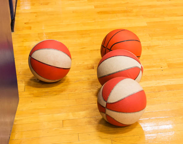 istock Four basketballs on a court 1081162364