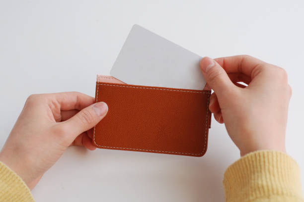 istock scene of putting card in wallet 1081167484