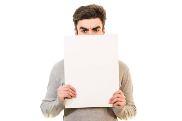 istock The man showing the blank paper on the white background 1081171982