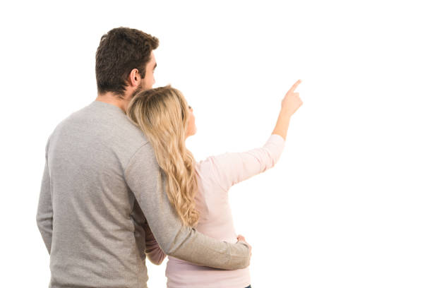 The couple showing a finger on the white background