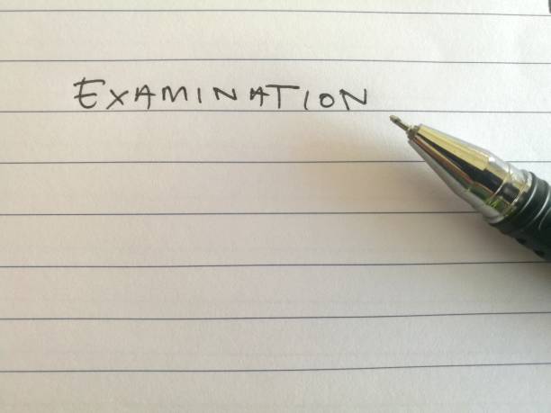 istock The word 'examination' written on paper 1081173106