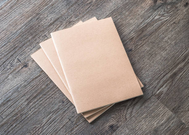 istock Blank book mock up, catalog, magazines or note cover template with recycle brown paper texture on table floor 1081175586