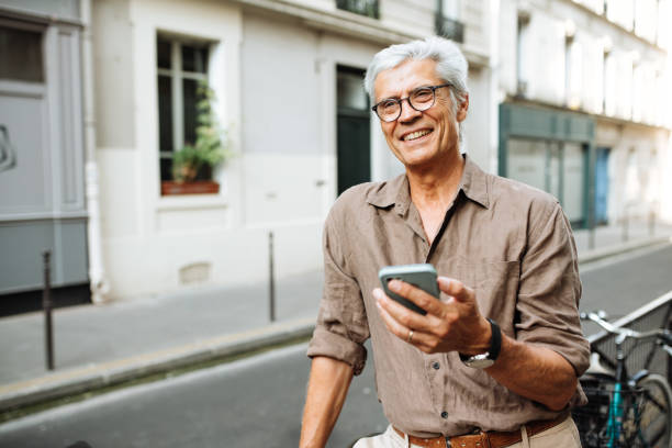 istock Easy navigation with cellphone app for this senior men in Paris 1081176118