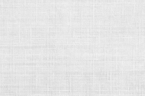 White jute hessian sackcloth canvas sack cloth woven texture pattern background in white light grey color