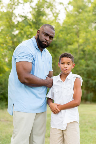 istock Father and his son flexing their biceps. 1081185024