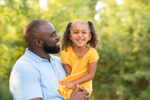 istock Father laughing and playing with his daugher. 1081185052