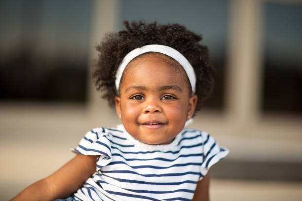 istock Little girl laughing and smiling 1081185404