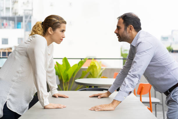 Angry business opponents arguing with each other