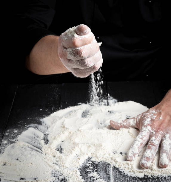 istock white wheat flour on a black wooden table 1081200152