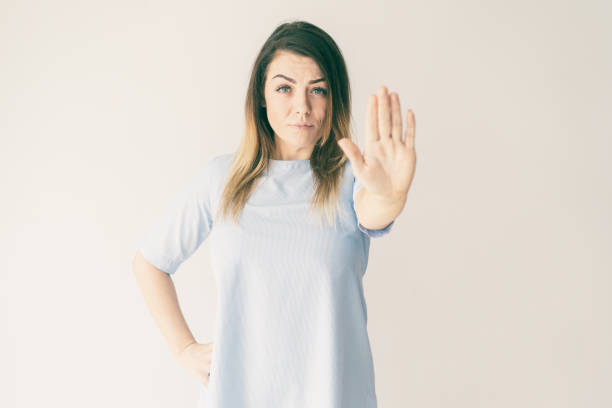 istock Serious woman showing open palm or stop gesture 1081201720