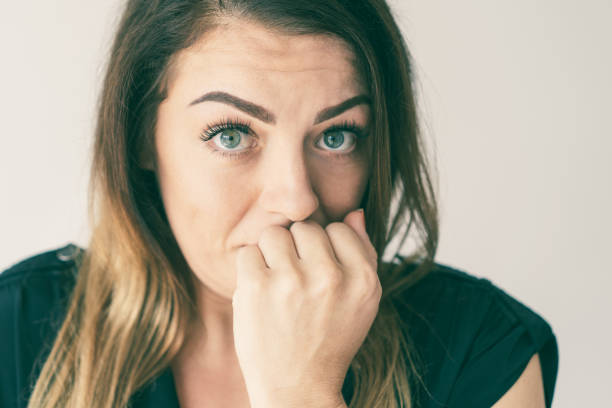 istock Concerned anxious young woman worrying and looking at camera 1081201798